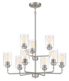 The Stowe - 56029 is a modern chandelier with a brushed nickel finish, featuring nine cylindrical clear glass shades. Designed with two tiers on a central rod and horizontal arms, each shade hosts an exposed bulb, adding a contemporary industrial flair pe