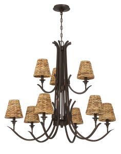 The Kokomo - 58329 is a large Craftmade chandelier featuring a dark metal frame and twelve light brown woven lampshades. The elegant wicker design is arrayed in two tiers hanging from a central stem, ensuring it complements sconces for a unified aesthetic