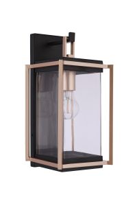 The Metalwork - ZA6504-MNSB by Craftmade is a sleek, wall-mounted outdoor lighting fixture with a rectangular glass enclosure, black metal housing, and copper accents. Ideal for any outdoor space, its clear glass displays a prominent bulb inside.