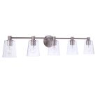 The Emilio - 12642 from the Vanity Collection offers transitional lighting with five clear glass shades on a brushed metal bar. The unlit bulbs in each shade are mounted to a circular metal base, blending style and functionality.