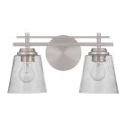 The Drake - 19616 is a modern wall light with a double rail silhouette, featuring two clear seeded glass shades and bulbs. It boasts a sleek brushed polished nickel finish with horizontal bars connected to a round wall mount.