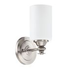 The Dardyn - 49801 wall-mounted silver sconce from the Dardyn series features a circular base, frosted white cylindrical glass shade, and a brushed metal fixture, centrally supporting the shade with an elegant design.