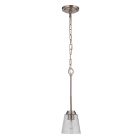 The Tyler - 50291 pendant light features a flat black finish chain and frame, a clear seeded glass shade, and a visible bulb for added charm, elegantly hanging from a ceiling plate.