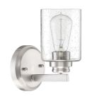 The Bolden - 50501 wall-mounted light fixture features a cylindrical clear seeded glass shade, visible filament bulb, and a sleek brushed metal base and arm for a modern look.
