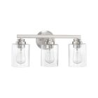 Part of the luxurious Bolden - 50503 collection, this modern bathroom vanity light features three clear glass shades with brushed nickel hardware. Vintage-style Edison bulbs are attached to a horizontal bar connected to a round wall mount.