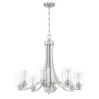 Part of the Bolden - 50528 line, this brushed nickel chandelier features a modern design with six curved arms holding clear cylindrical glass shades. The visible bulbs provide bright illumination while the fixture is elegantly suspended by a ceiling-mount