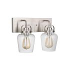 The Trystan - 53502 is a wall-mounted light fixture with a sleek, brushed metal finish. It features two dome-shaped clear glass globes, each with an exposed filament vintage-style bulb inside, offering innovative lighting.