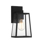 The Dunn - ZA4314-TB is a modern outdoor lantern wall sconce with a textured black finish and clear glass panels featuring a vintage-style bulb. The droplets of water on the glass suggest recent rain, adding an elegant transitional touch.